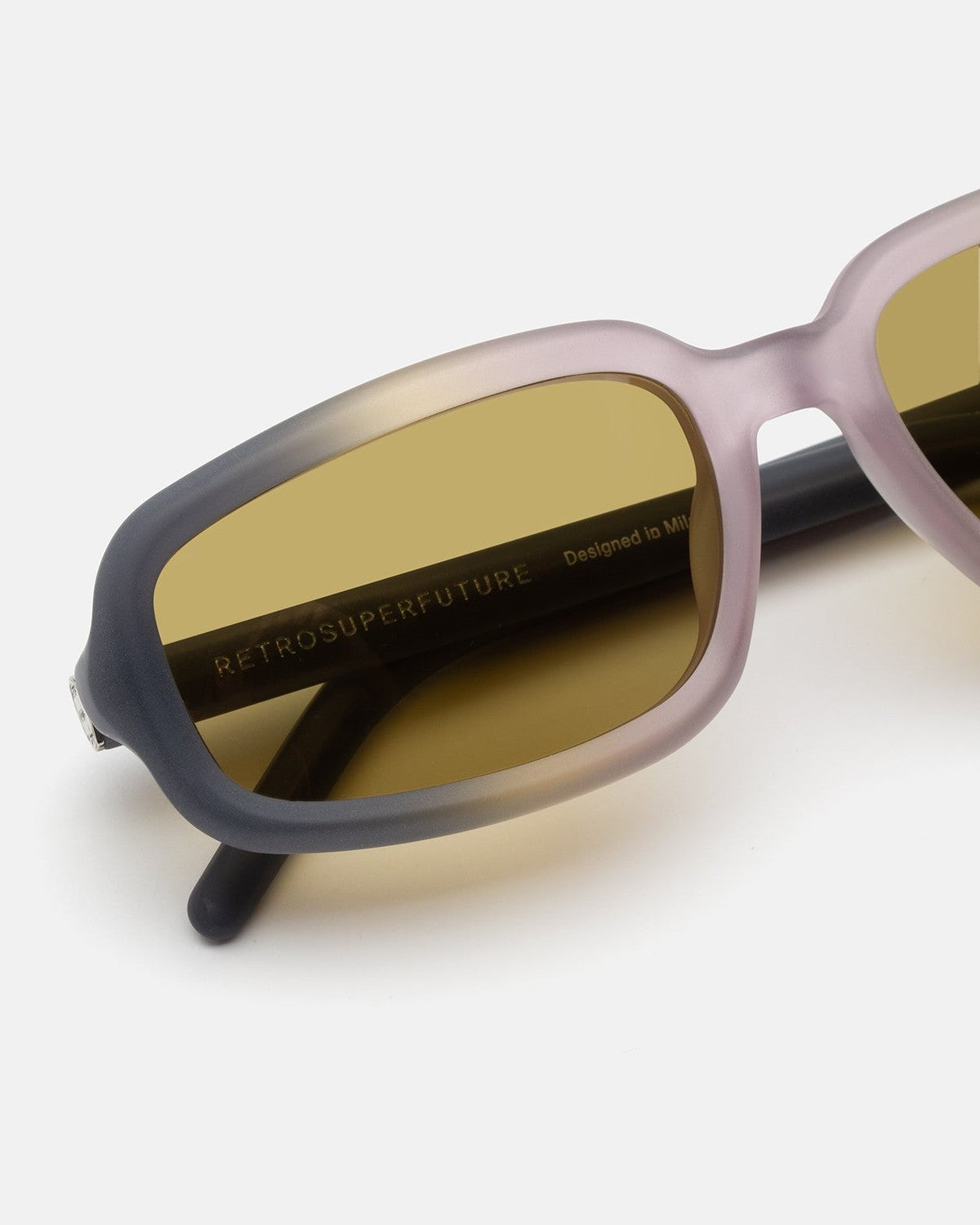 Close-up of the lens and frame fade detail on RETROSUPERFUTURE Troll Side Fade sunglasses.