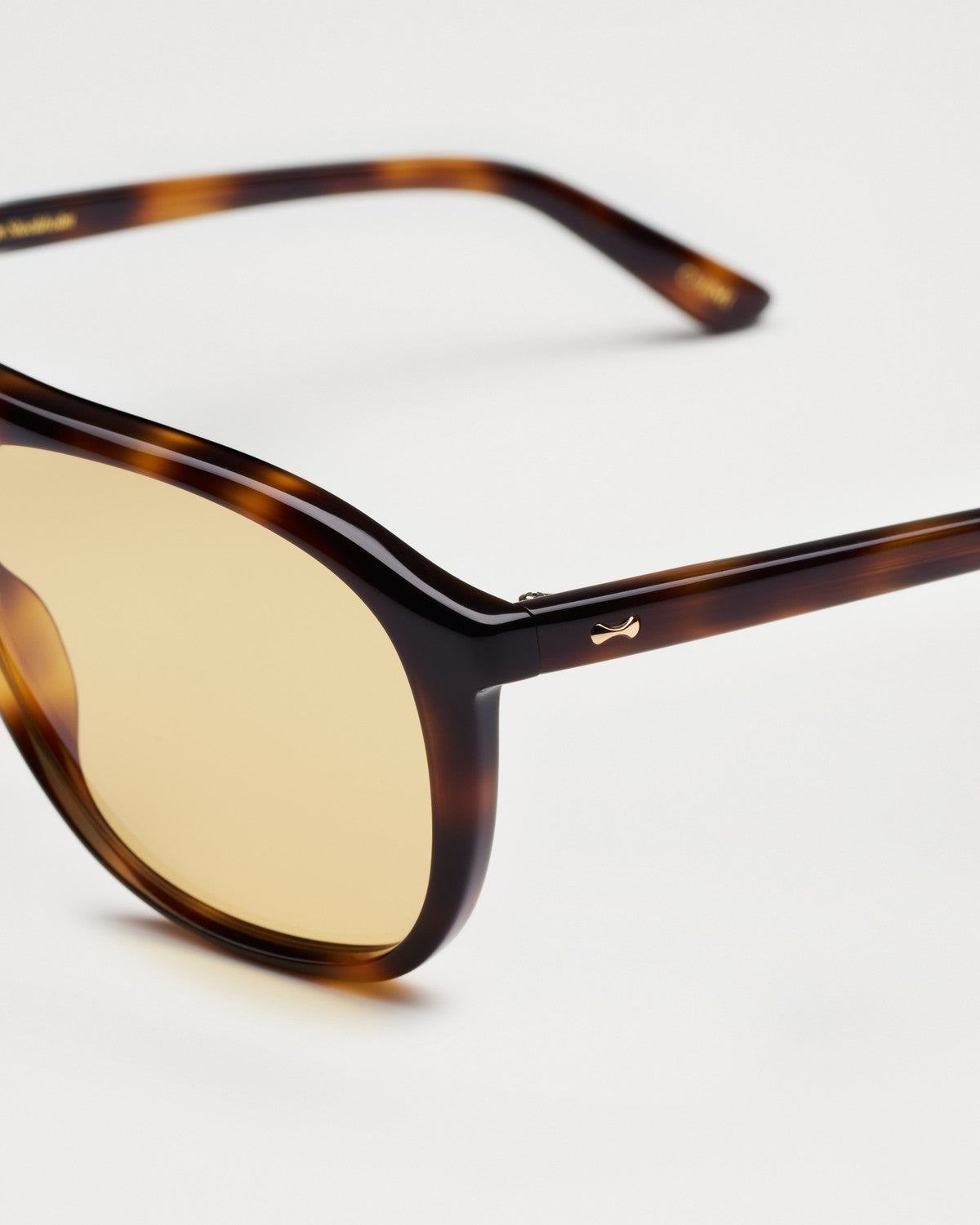 Close-up of the temple and bridge detail on CHIMI Uma Tortoise Yellow sunglasses.