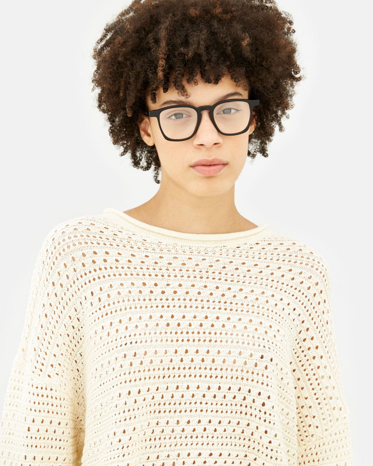 Model wearing RETROSUPERFUTURE Unico Nero eyeglasses, front view.