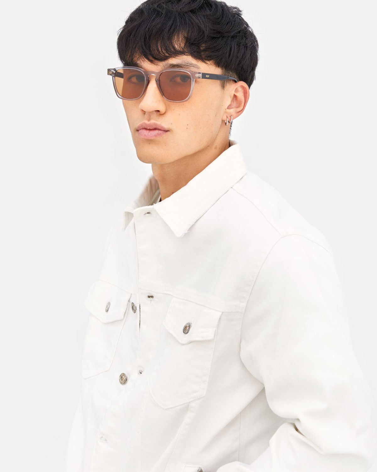 Side profile of model wearing RETROSUPERFUTURE Unico Stilo sunglasses.