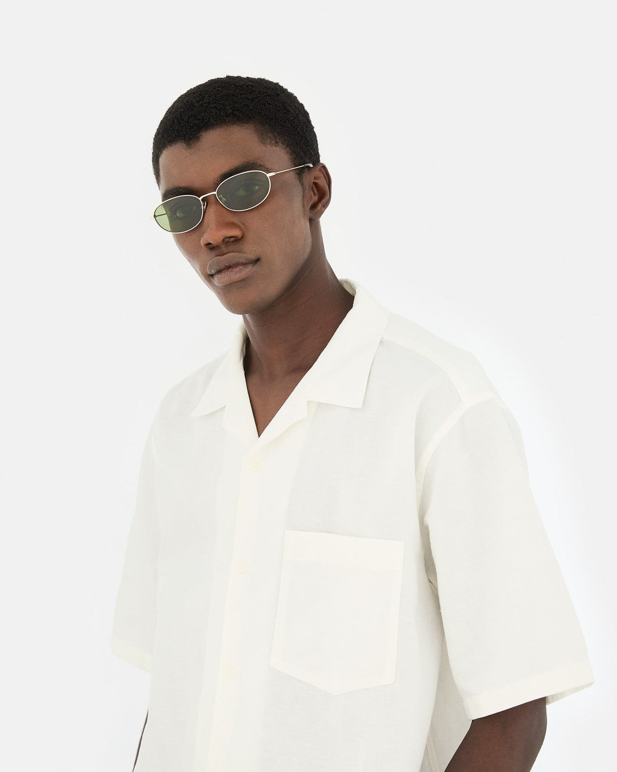 Model wearing RETROSUPERFUTURE Uovo Classico sunglasses with white shirt.