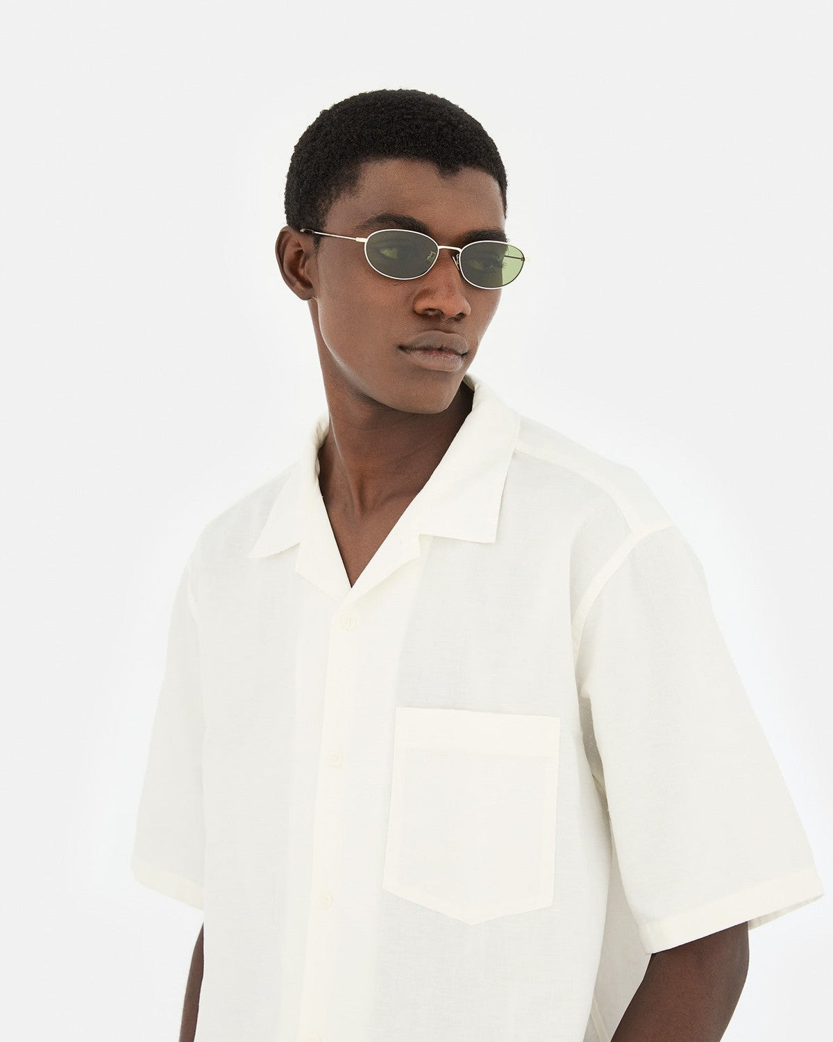 Side profile of model wearing RETROSUPERFUTURE Uovo Classico sunglasses.