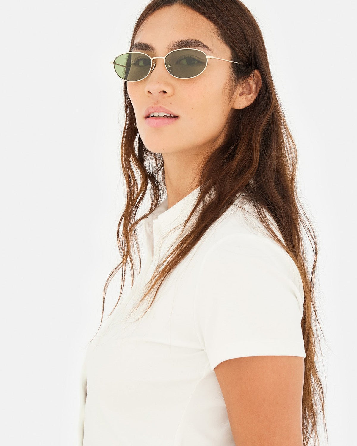 Lifestyle shot of model wearing RETROSUPERFUTURE Uovo Classico sunglasses.