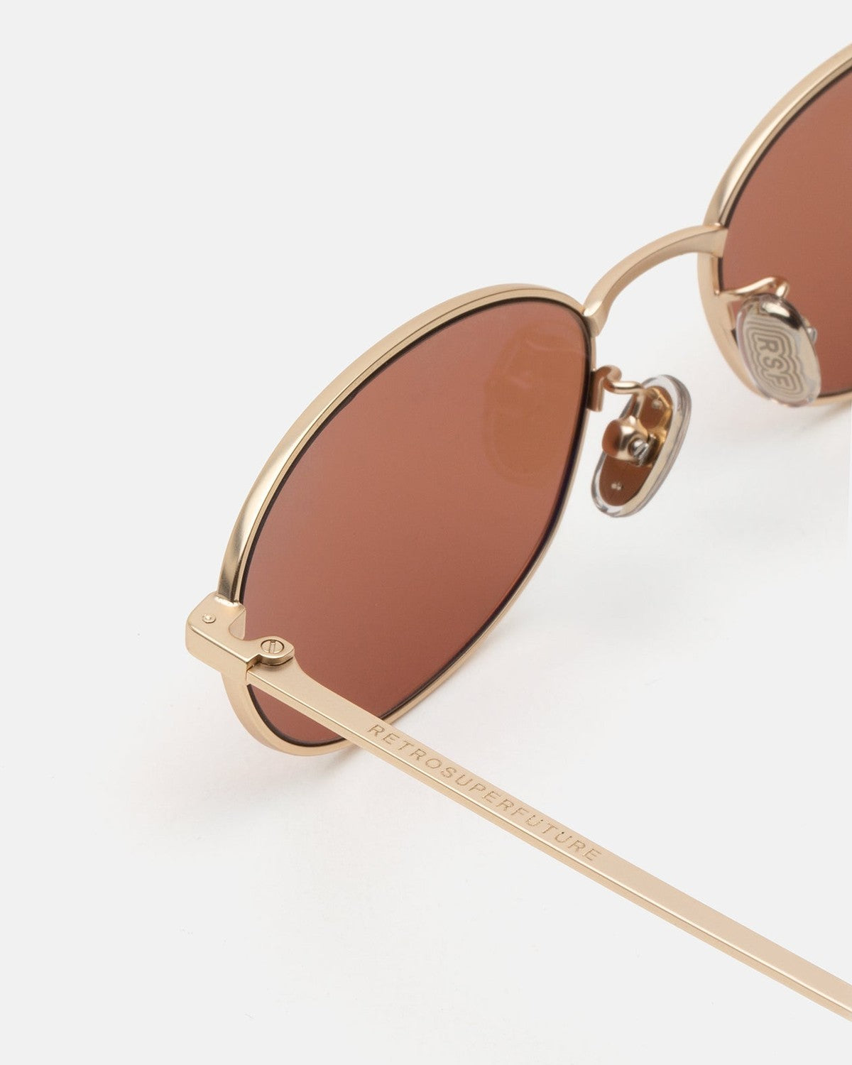 Detail of the metal bridge and nose pads on RETROSUPERFUTURE Uovo Graffiato sunglasses.