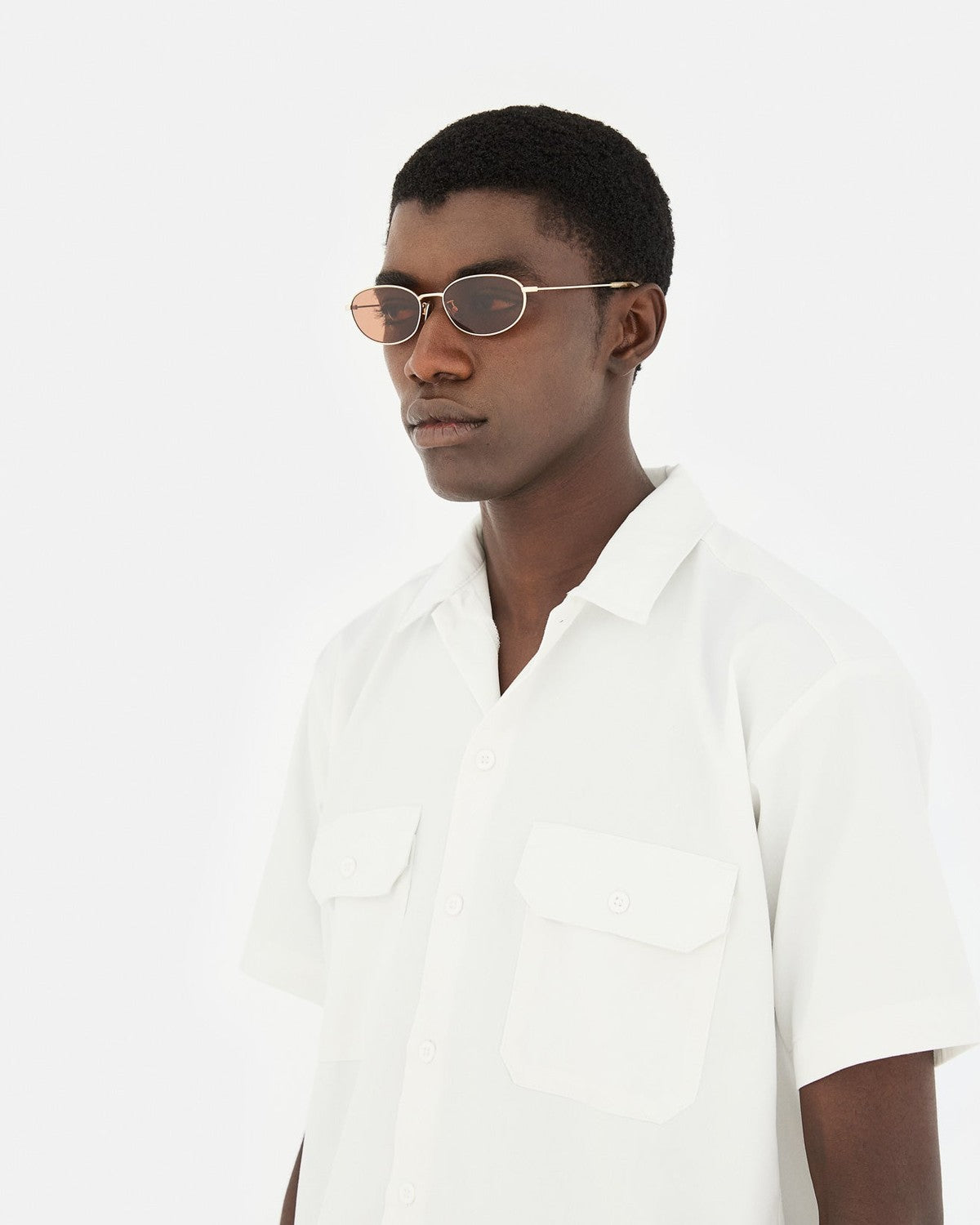 Side profile of model wearing RETROSUPERFUTURE Uovo Graffiato sunglasses.