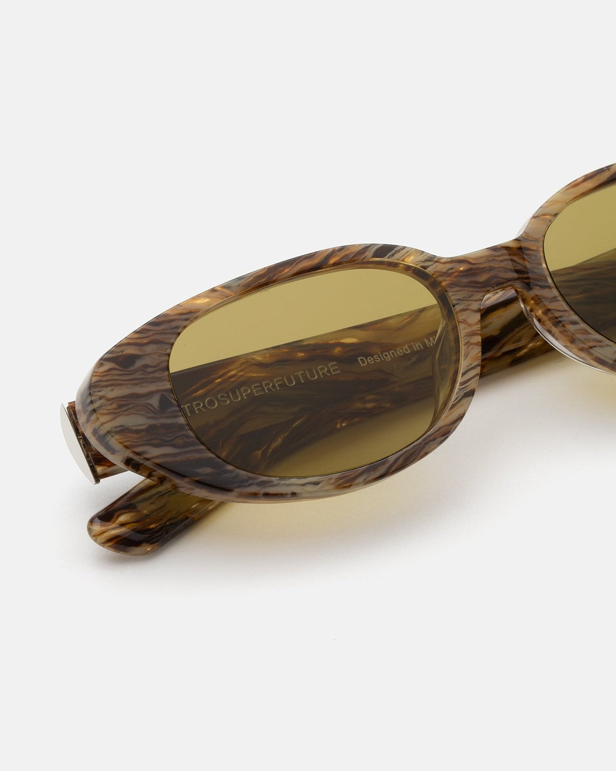 Close-up of the frame texture and lens engraving on RETROSUPERFUTURE Vega Graffiato sunglasses.