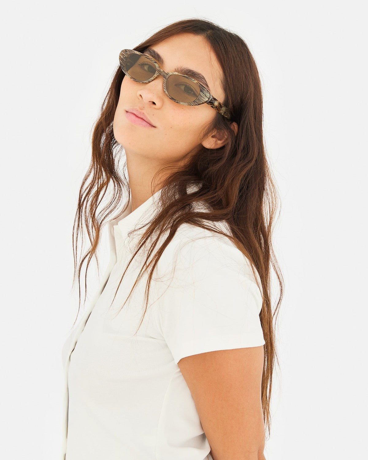 Model wearing RETROSUPERFUTURE Vega Graffiato sunglasses tilting head upward.