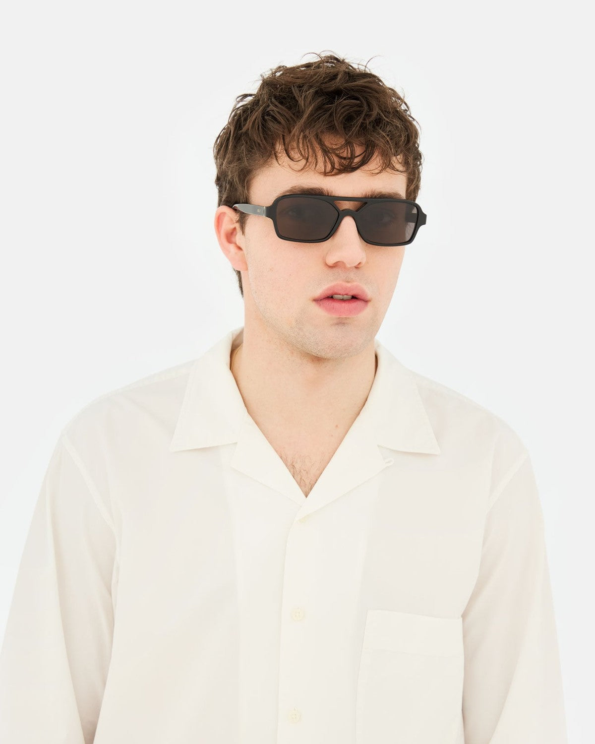 Model wearing RETROSUPERFUTURE Vico Black sunglasses.