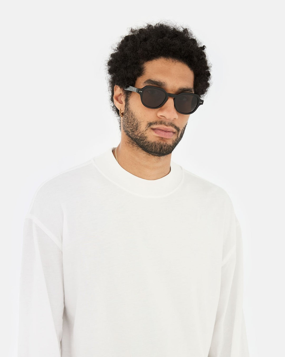 Model wearing RETROSUPERFUTURE Voce Black sunglasses.