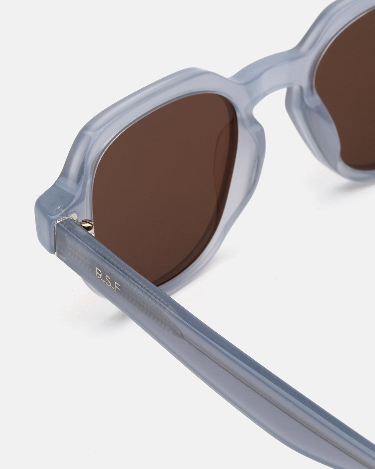 Detail of the temple hinge on RETROSUPERFUTURE Voce Light Blue sunglasses.