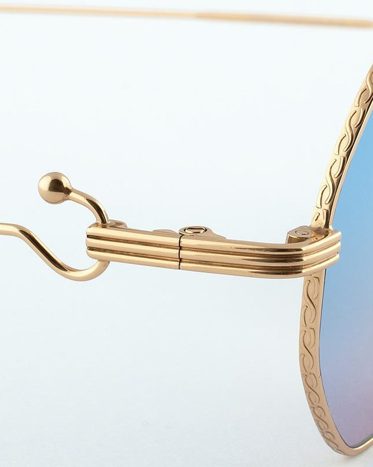 Close-up of the decorative bridge and skull end-tip detail on EYEPETIZER VOYAGE C.4-42F sunglasses.