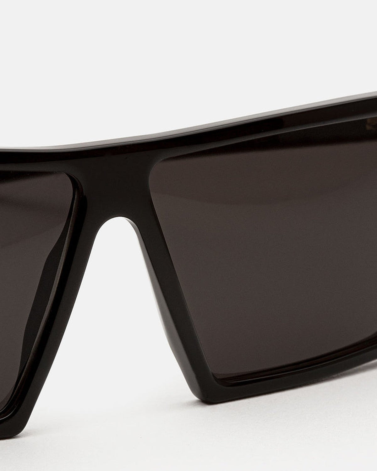 Close-up of the bridge and angular frame geometry on RETROSUPERFUTURE W Black sunglasses.