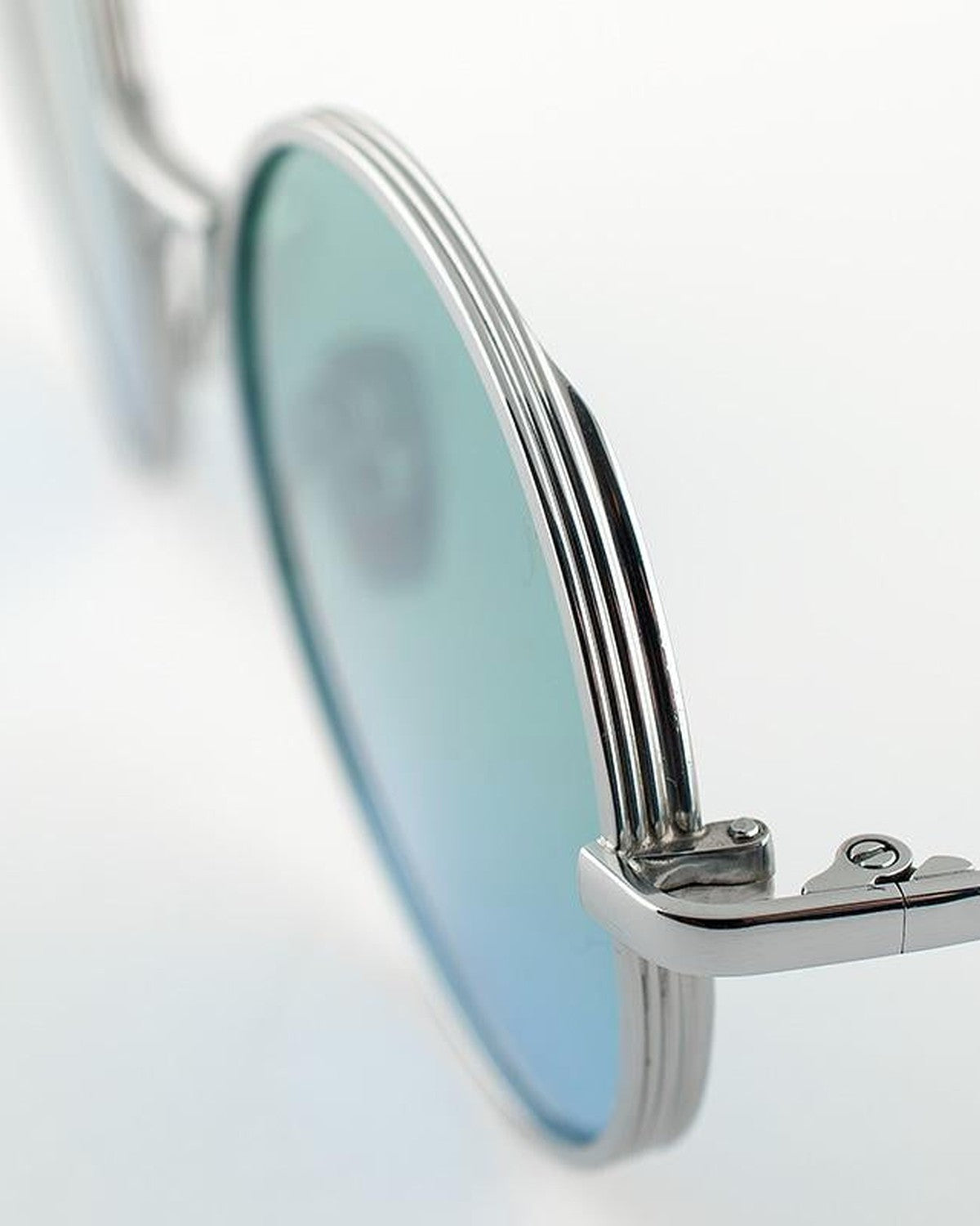 Close-up of the wire-core temple and hinge detail on EYEPETIZER WILLIAM C.1-43F sunglasses.