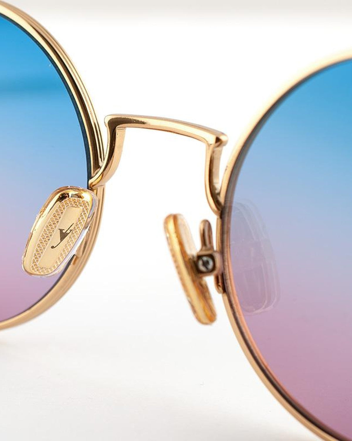 Close-up of the nose bridge and brand plaque on EYEPETIZER WILLIAM C.4-42F sunglasses.
