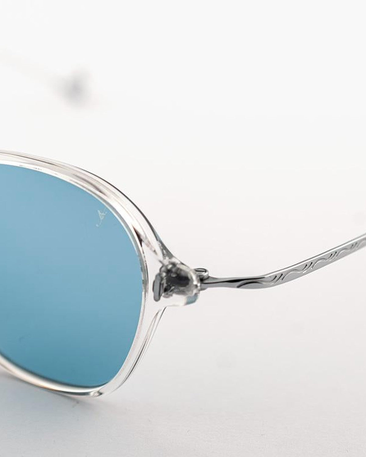 Close-up of the engraved temple and hinge detail on EYEPETIZER WINDSOR C.Y-1-2F sunglasses.
