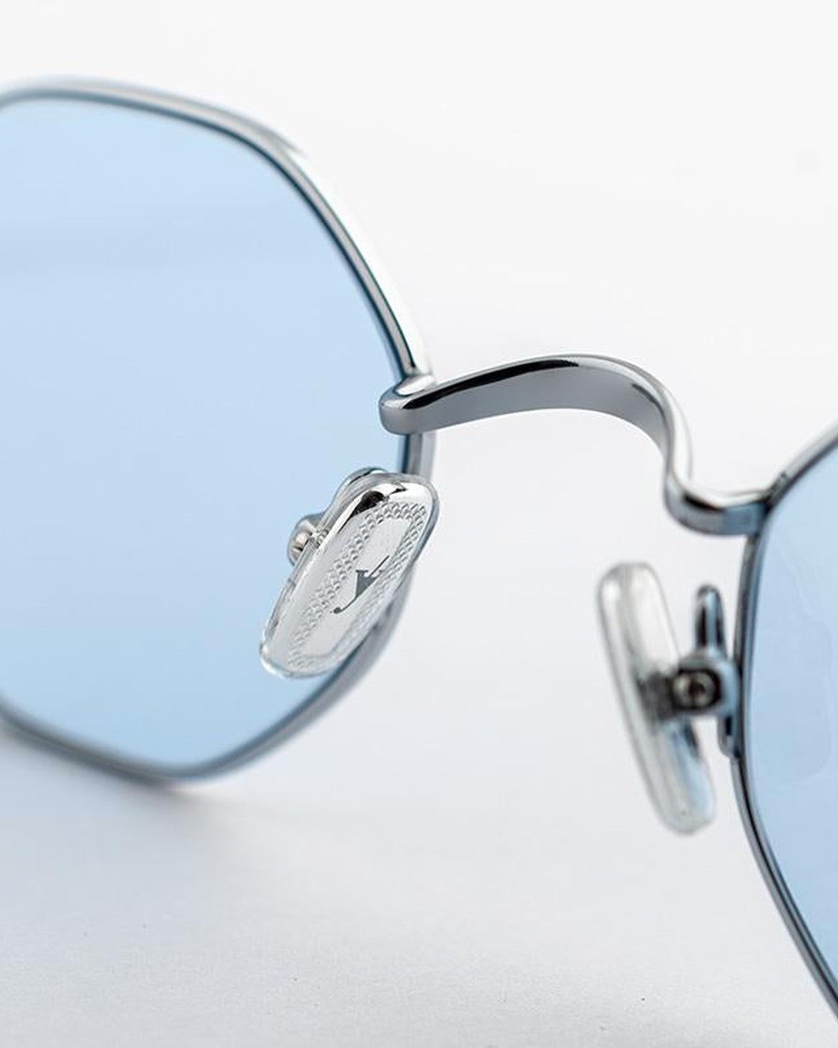 Close-up of the nose bridge and brand logo on EYEPETIZER WOODY C.1-2 sunglasses.