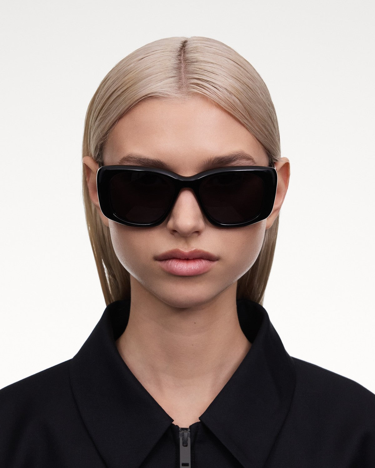 Model wearing CHIMI X15 Black Black sunglasses in a front portrait.