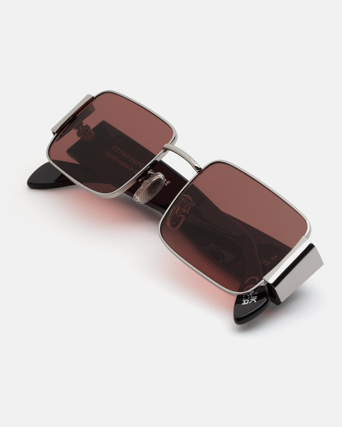 Overhead view of RETROSUPERFUTURE Z Bordeaux sunglasses folded.