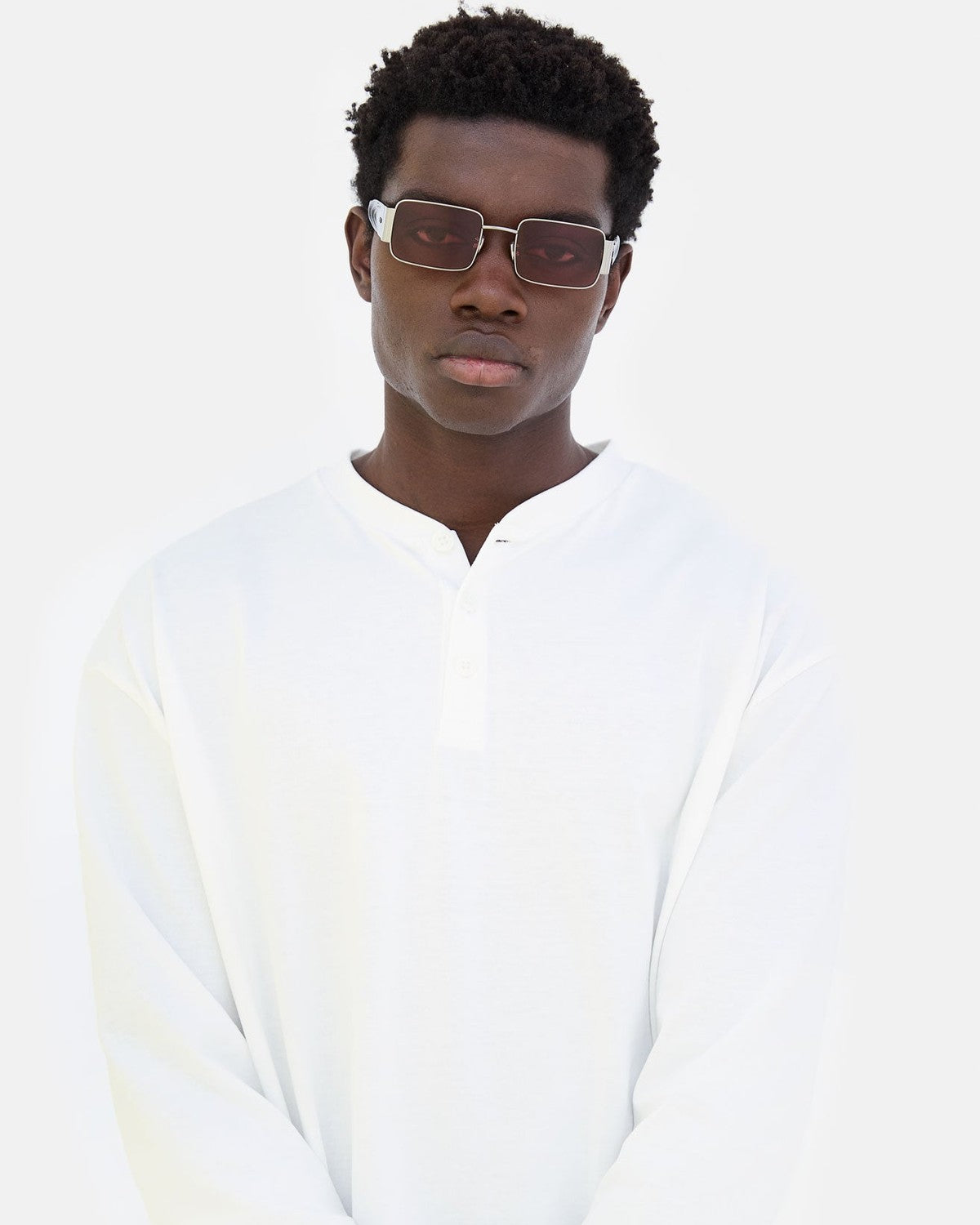 Model wearing RETROSUPERFUTURE Z Bordeaux sunglasses in front view.