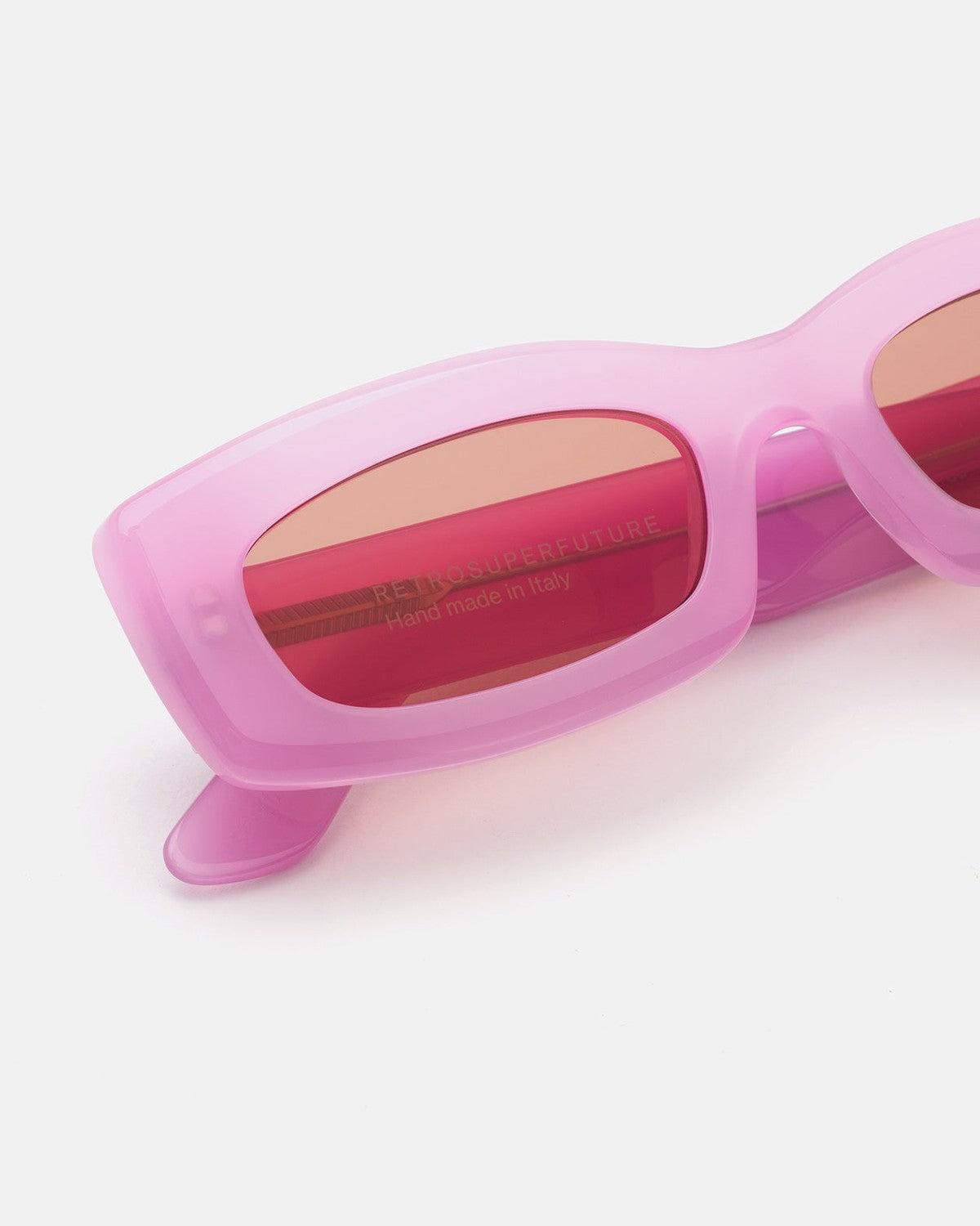 Close-up of the temple and lens on RETROSUPERFUTURE Zaga Pink sunglasses.
