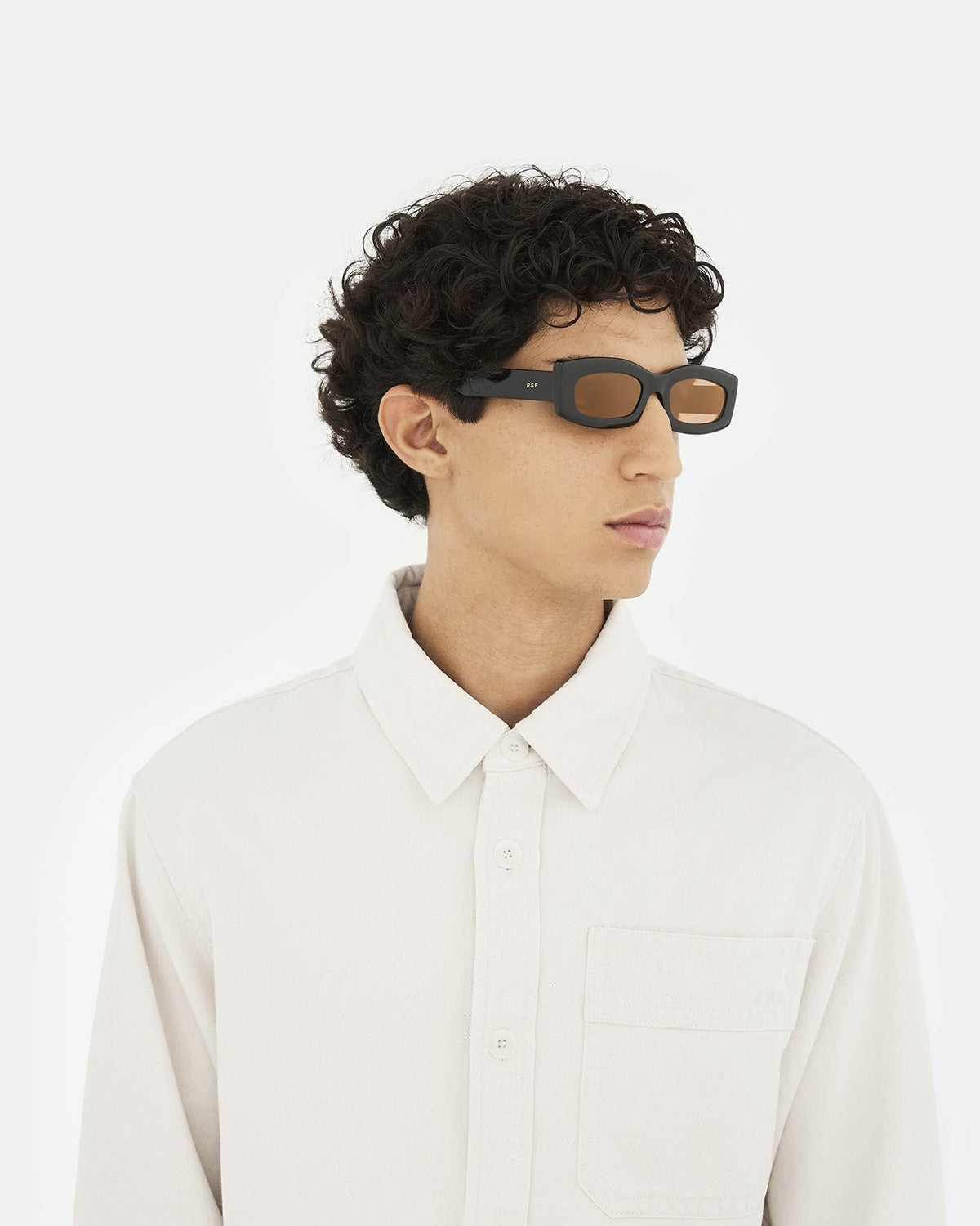 Side profile of model wearing RETROSUPERFUTURE Zaga Refined sunglasses.