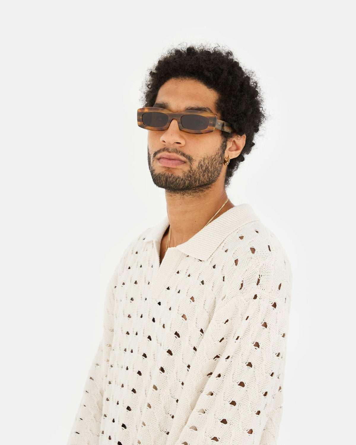 Model wearing RETROSUPERFUTURE Zaga Tangeri sunglasses, side view.