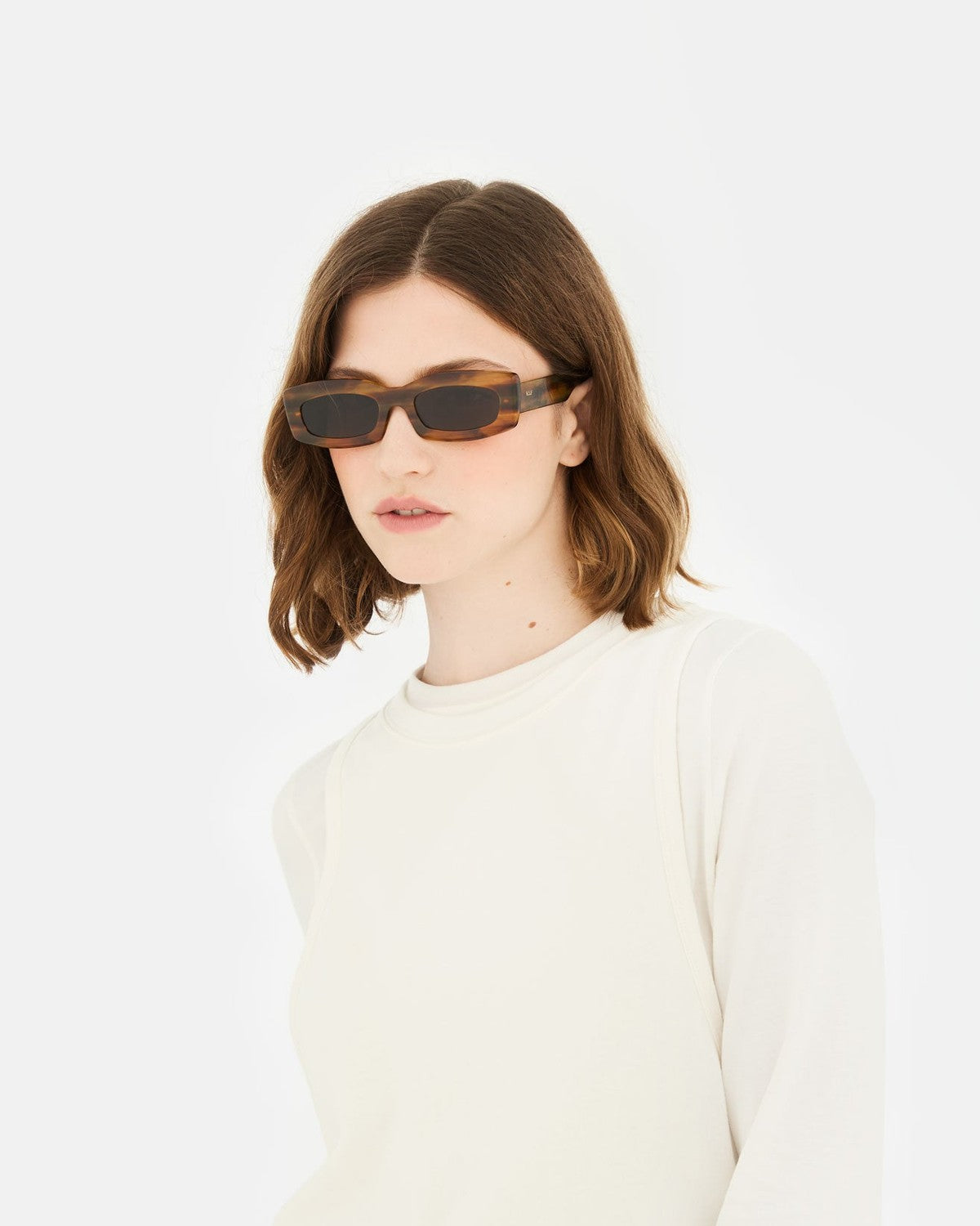 Model wearing RETROSUPERFUTURE Zaga Tangeri sunglasses, front view.