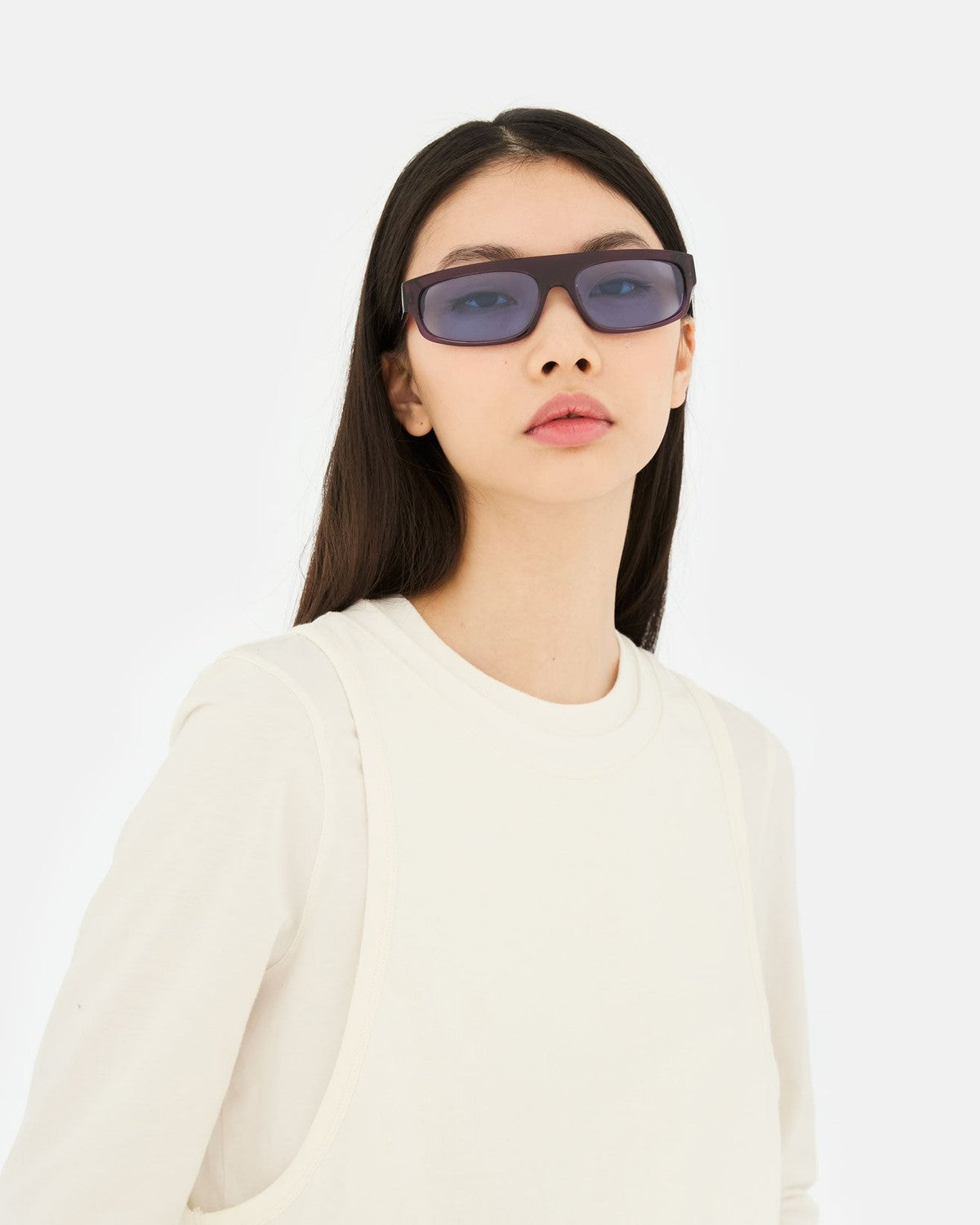 Model wearing RETROSUPERFUTURE Zam Melanzana sunglasses with cream top.